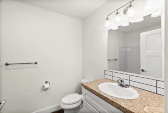 Just to the left of the ground floor bedroom is the first full bath featured in the home!