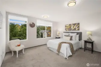 Massive primary bedroom with ample room for King bed, an assortment of furniture, with excellent Western exposure.