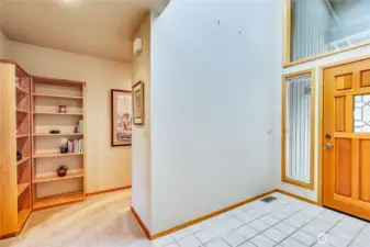 Passing by front entry on the way to the bedroom wing.