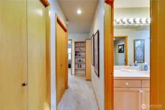 Moving down the hall towards second bedroom and bath.  Doors on left are storage closets.