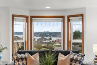 See whales and boats and mountains at sunset!