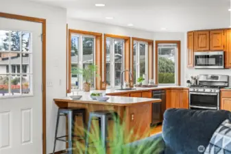 Counter seating and access to deck right off the kitchen.