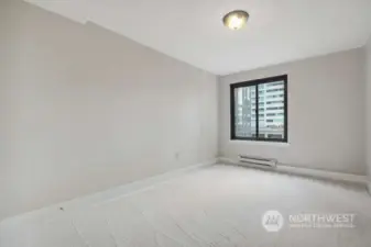 This long wall in the bedroom is a great spot for the bed with room for night stands.