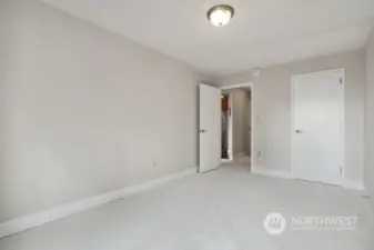 Another view of the bedroom with the closet door on the right.