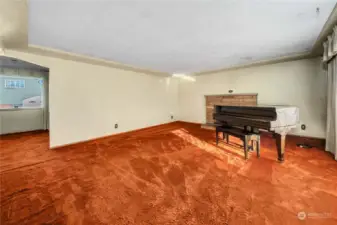 As you enter the living room, notice the wood-burning fireplace and coved ceiling. Classic 1957 style!