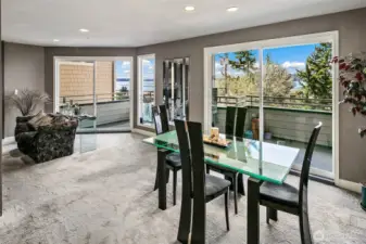 Dining room is large and easily can have a table for 8.  Double slider system doors to the full length deck out to your view and the sounds of Puget Sound.