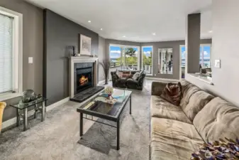 Living room boasts a gas fireplace.  Newer carpet and pad throughout the condo