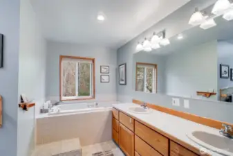 Bath with dual vanities and jetted tub.