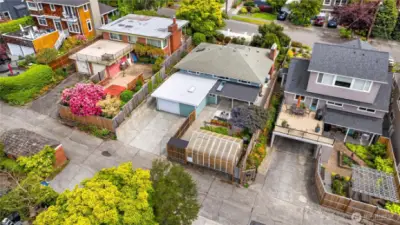This overhead view shows the layout of the off-street parking, greenhouse and back patio.