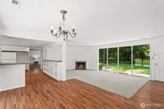 View from dining room looking into Family room.wood burning fireplace currently but can easily be converted to gas.Gas stub is right outside.