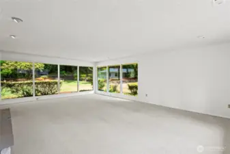 Another angle of Family room.Tons of natural light pour in from the windows.