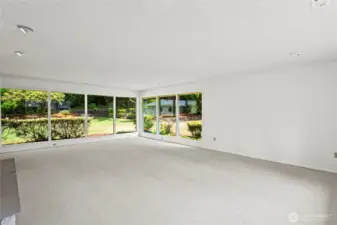 Another angle of Family room.Tons of natural light pour in from the windows.