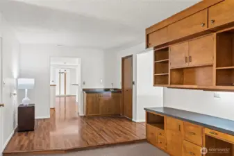 View as you come in from the garage.Tons of built ins as well as wet bar.