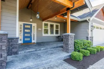 Exceptional grand entry with covered porch sitting area
