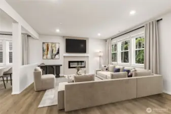 So much light throughout the great room, dining room and kitchen.  Photos are for representational purposes only. Colors and finishes may vary