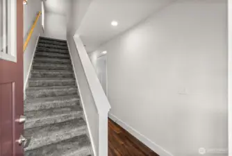 As you enter the home you can either take the stairs to the second level or continue onto the main floor living space.