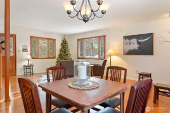 Cozy up and gather here all seasons comfortably. Hardwood floors. Large wood trimmed windows allow natural light and views.