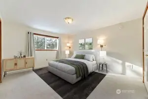 Primary Bedroom on upper floor is carpeted with large his/hers closet. Tons of natural light.