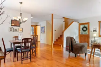 Natural light reflects off the hardwood Cherry-wood floors creating a warm glow.