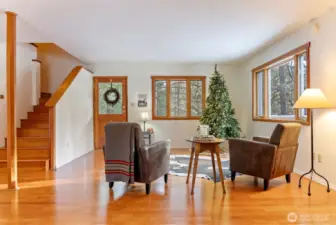 Clean aesthetics are yours with white walls and warm cherry-wood floors, stairway, doors and window trim. A blank canvas to make your own.