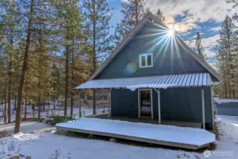 North side of home has covered deck and door from Kitchen to the outside.