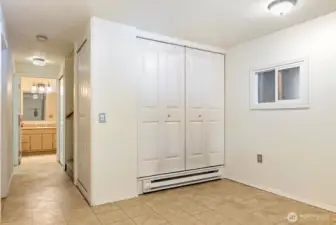 Covered entry mud room off of Carport area. Easy care floor linoleum. Large coat closet.