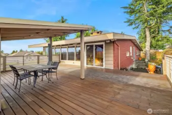 Covered deck for year round outdoor living.
