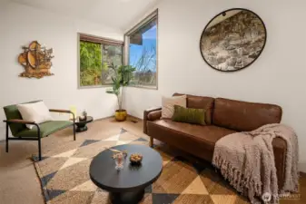 Connected to the living room and featuring a private entry, this room offers exceptional flexibility of use.