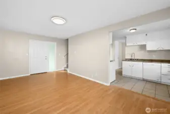 The easy layout offers entry, dining, and kitchen on one side, with laundry and living room on the other. All four bedrooms are upstairs.