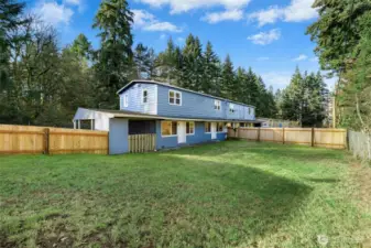 Spacious backyard of 5726 with two doors out to the back.