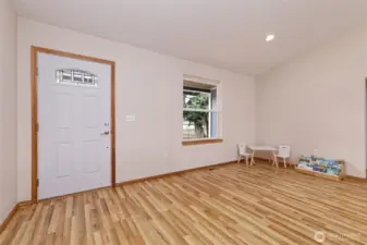 Open concept from the front entry into the ovesized great room.Smooth flowing clean lines and flooring and fresh paint.