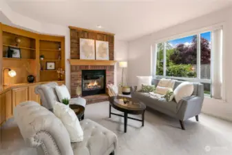 Custom built-in shelves & fireplace are highlights to this living area.