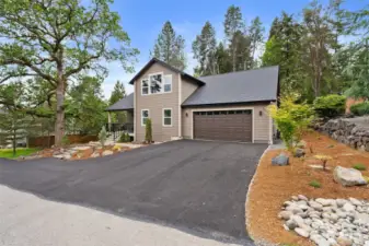 Welcome Home! Brand new home with blacktopped driveway, professionally landscaped and hardscaped front yard in Northwest style with pavers, boulders and evergreens.