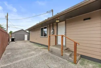 Side door into kitchen. Paved driveway with access from front. Fully fenced.