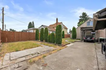 Alley access to rear driveway. Use the additional 1200 sqft  to develop the back portion lot. 2 tiny homes for additional income. Buyer to verify with the city planning.