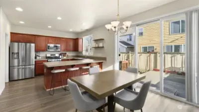 Generously sized dining room is open to the kitchen and living room. Sliding door lead to the backyard.