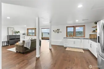 Downstairs family room and half kitchen with views