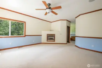 Primary bedroom includes gas fireplace  and his-hers walk in closets with organizer