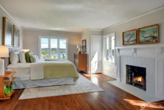 Watch the sun come up over Mt Rainier from bed in this huge primary bedroom with cozy gas fireplace.