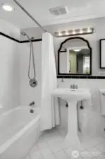 Lower level full bath with Art Deco flair.