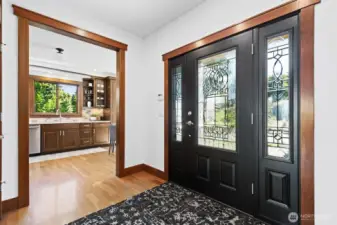 Entering, to the right is the kitchen. To the left is the powder room.