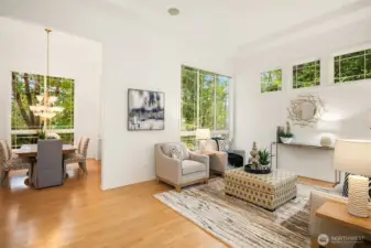 The spacious living room seamlessly flows into the elegant dining area, creating an open-concept layout that’s perfect for entertaining and everyday living.