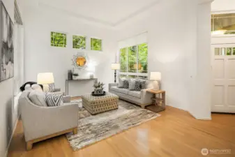 Soaring ceilings and expansive windows in the formal living room.