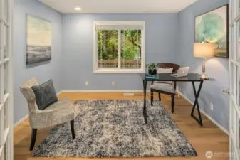 French doors lead to dedicated office space, set away from noise and commotion of kitchen and family room