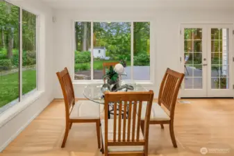Huge casual dining space , enormous windows flood the space with light