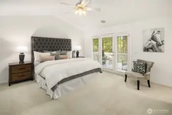 Primary Suite features French doors to the upper deck and 2 huge walk in closets