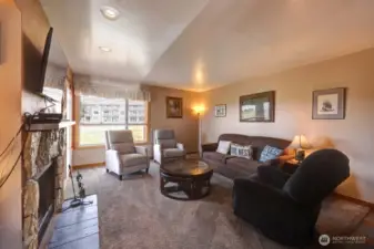 Cozy living room w/door to patio and fireplace