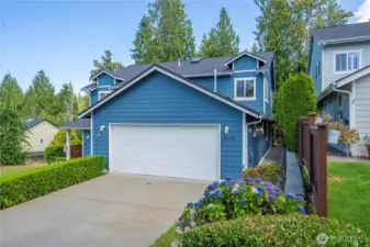 Lush, established landscaping offers a warm welcome