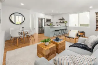 Main floor living flows to a spacious, fully fenced yard with peak views of the Sound