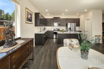This gorgeous DR Horton resale (2020 build) is sparkly clean and ready for you to move in! Great open concept living, dining and kitchen area with large kitchen island (seats 3 bar stools easily), stainless appliances, ample cabinetry and a nice sized pantry off to the right of the island.